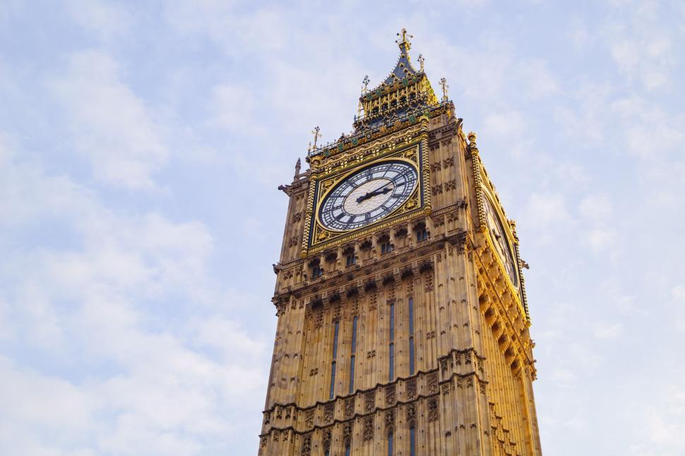 Free Image of Towering Clock Tower Against Sky Background 