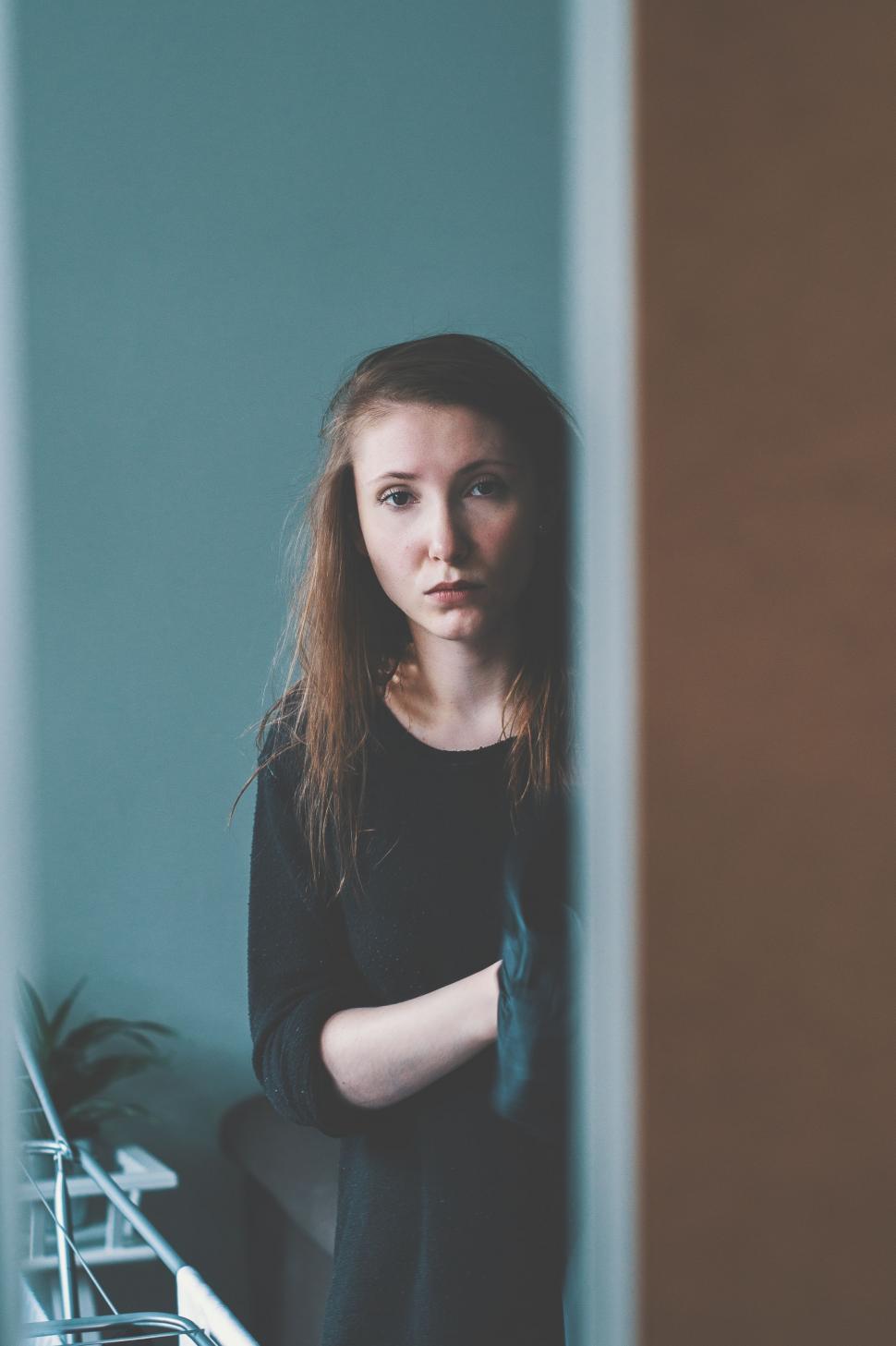 Free Image of Woman Standing in Front of Mirror 