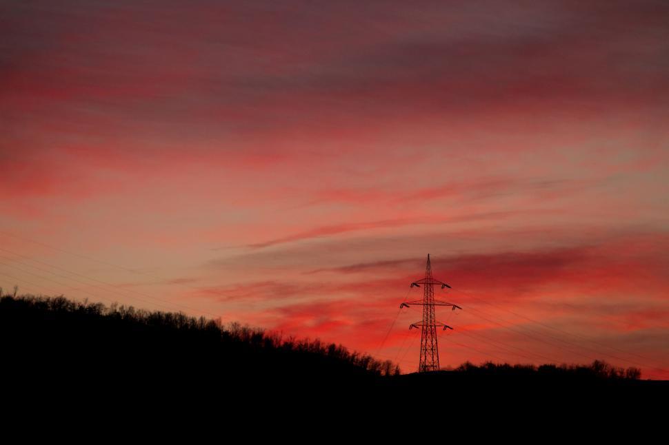 Free Image of Red Sky Over Distant Tower 