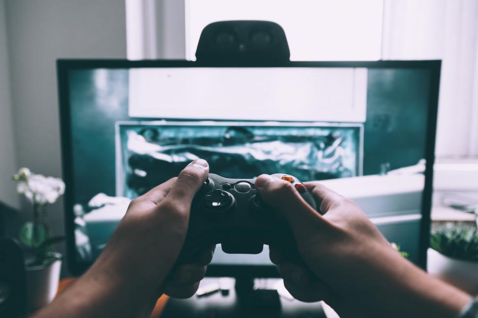 Free Image of Person Playing Video Game in Front of TV 