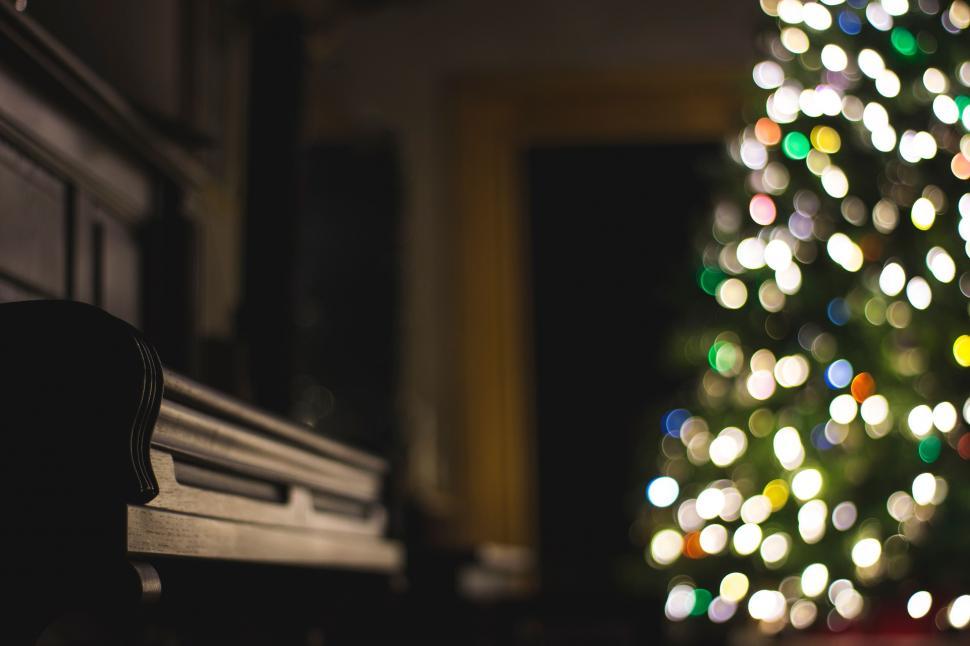 Free Image of Illuminated Christmas Tree in Dark Room 