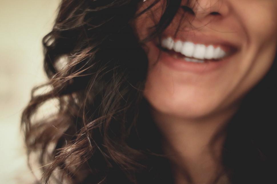 Free Image of Smiling Woman With Long Hair Close Up 