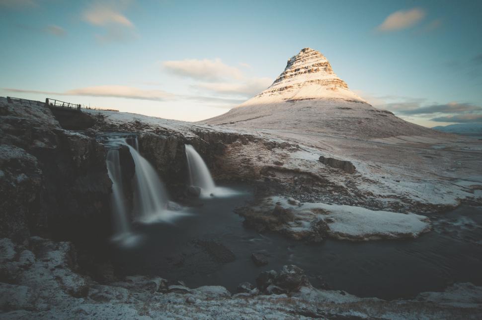 Free Image of A Mountain With a Waterfall in the Middle 