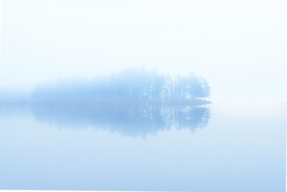 Free Image of Large Body of Water With Distant Tree 