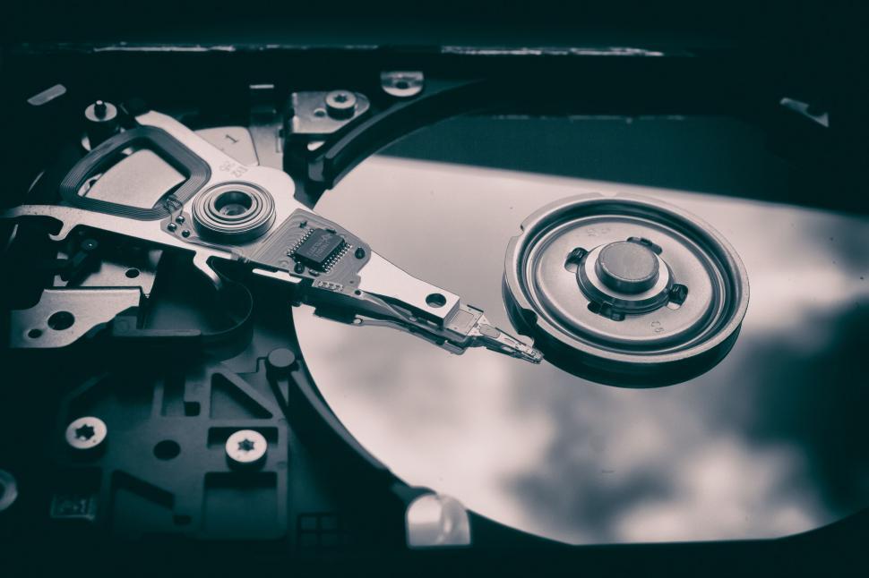 Free Image of Close Up of a Hard Drive With a Wrench 