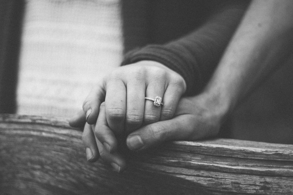 Free Image of Couple Holding Hands in Black and White 