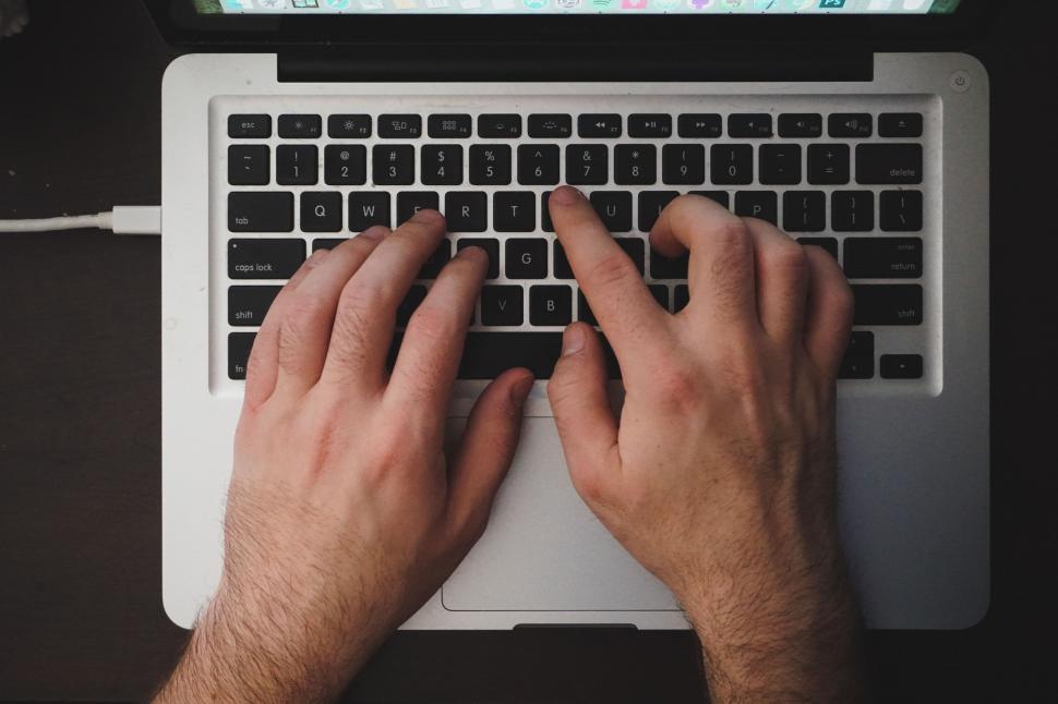 Free Image of Person Typing on a Laptop 