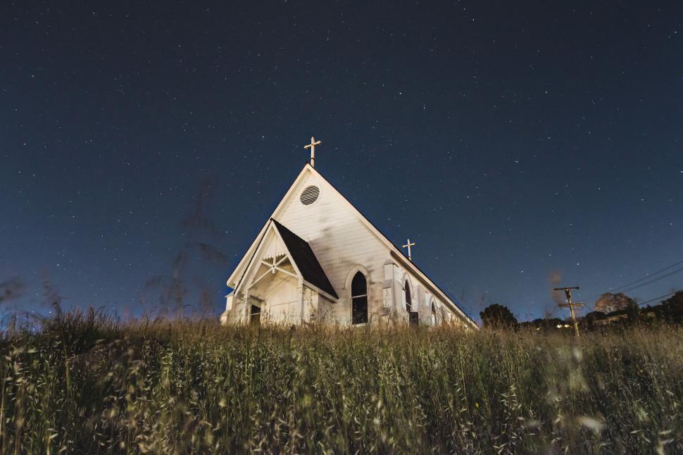 Free Image of Church Standing in Field of Tall Grass 