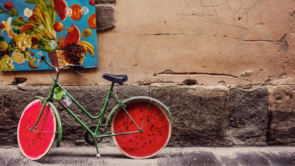 Free Image of Watermelon-Painted Bicycle Parked in Front of Wall 