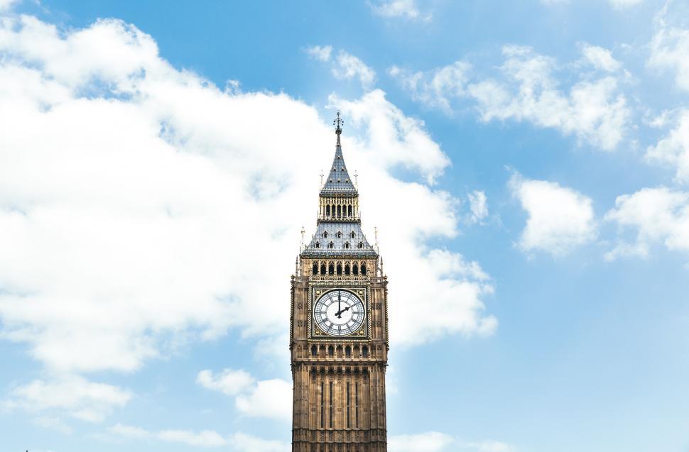 Free Image of Majestic Clock Tower Against Sky Background 