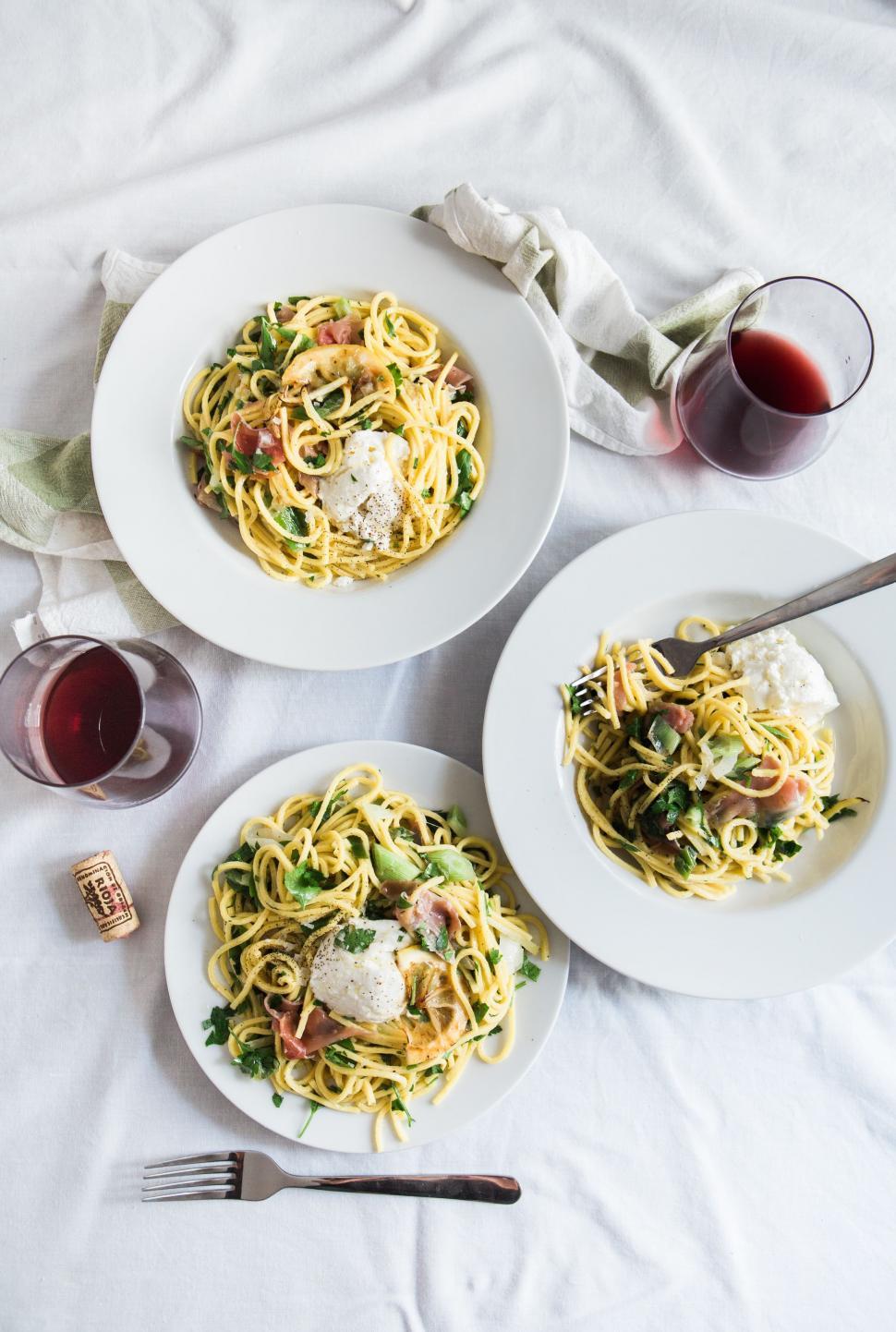 Free Image of Three Plates of Spaghetti and a Glass of Wine 