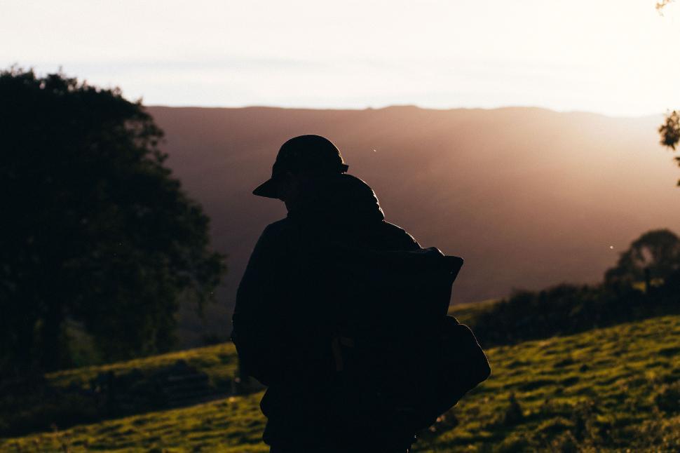 Free Image of Person Standing on Hill With Backpack 