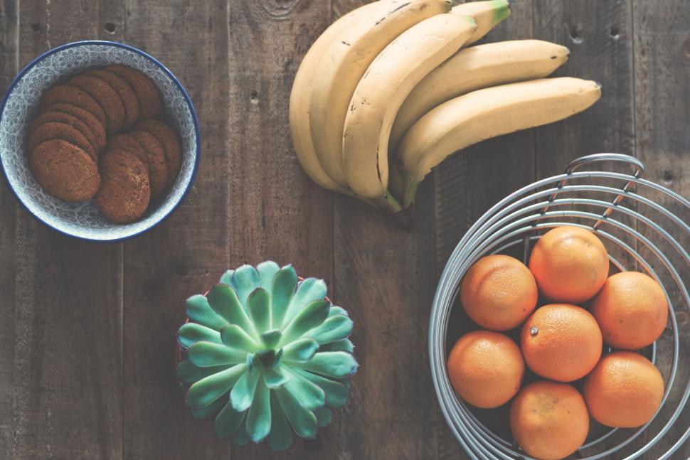 Free Image of Wooden Table With Bowls of Fruit and Bananas 