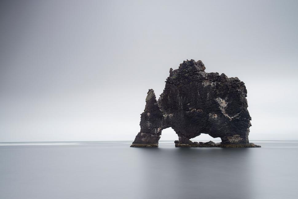 Free Image of Rock Standing in Middle of Water 