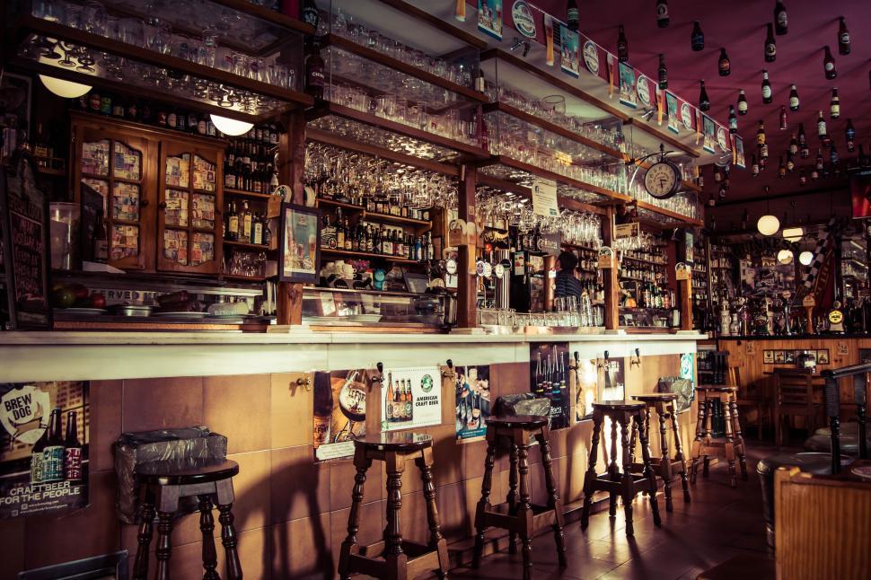 Free Image of A Bar With Many Stools 
