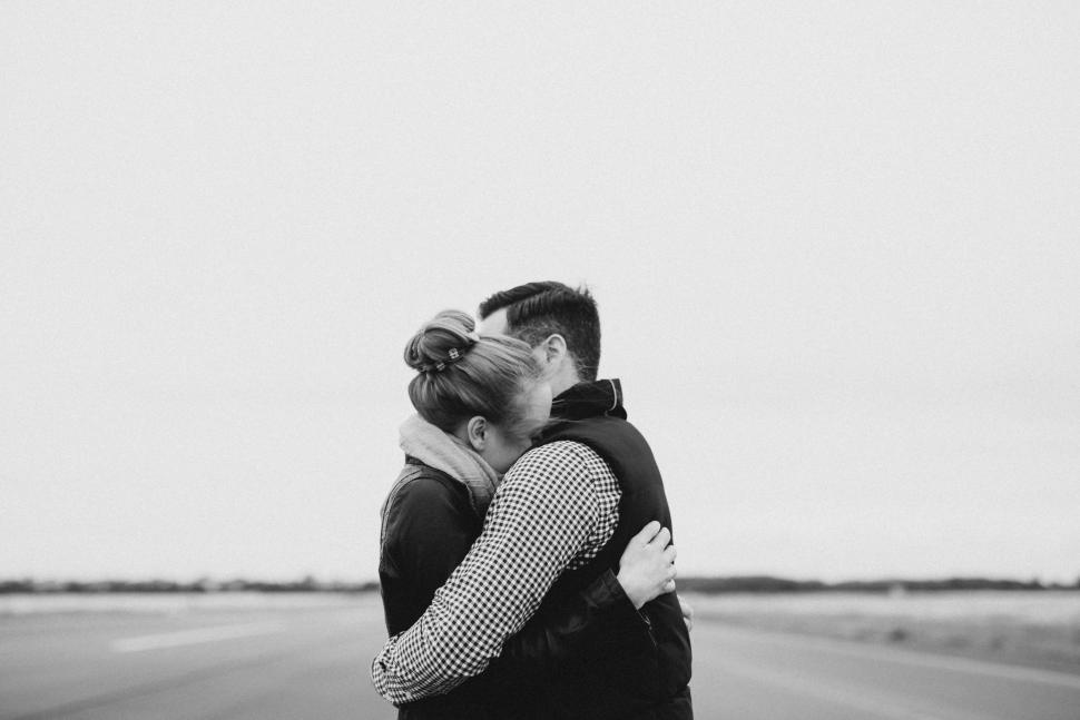 Free Image of Man and Woman Hugging on Side of Road 