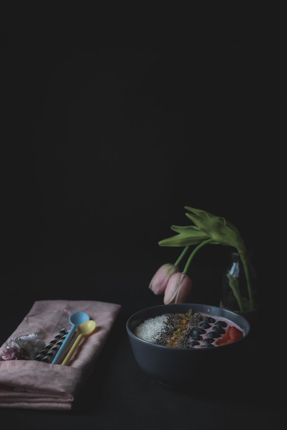 Free Image of Black Table With Bowl of Food and Green Plant 