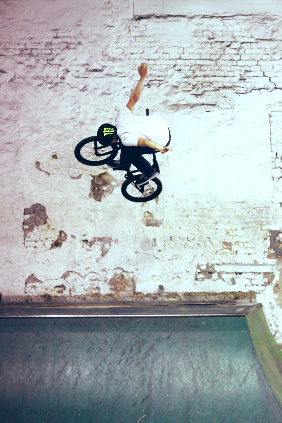 Free Image of Person Riding a Bike Down a Ramp 
