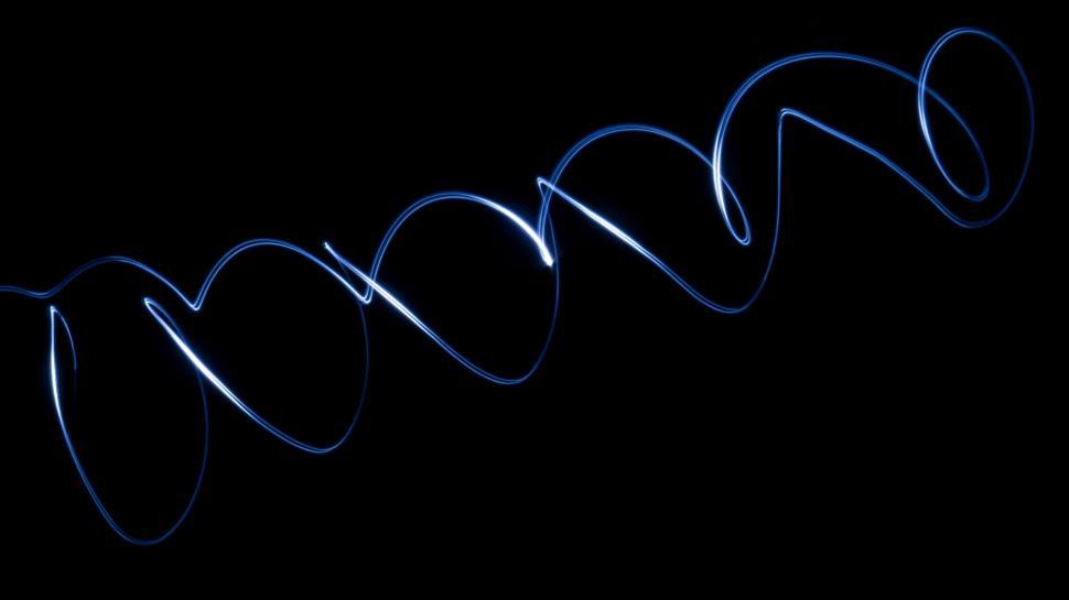 Free Image of Blue Spiral of Light on a Black Background 