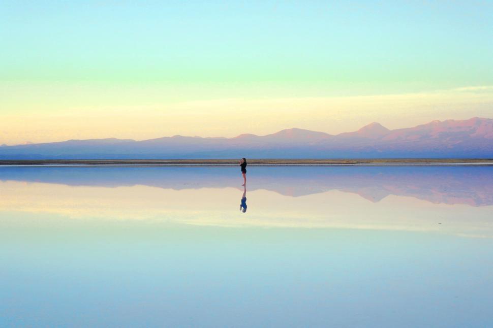 Free Image of Person Standing Alone in Middle of Lake 