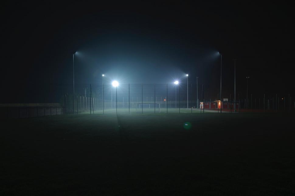 Free Image of A Foggy Night With Street Lights in the Dark 