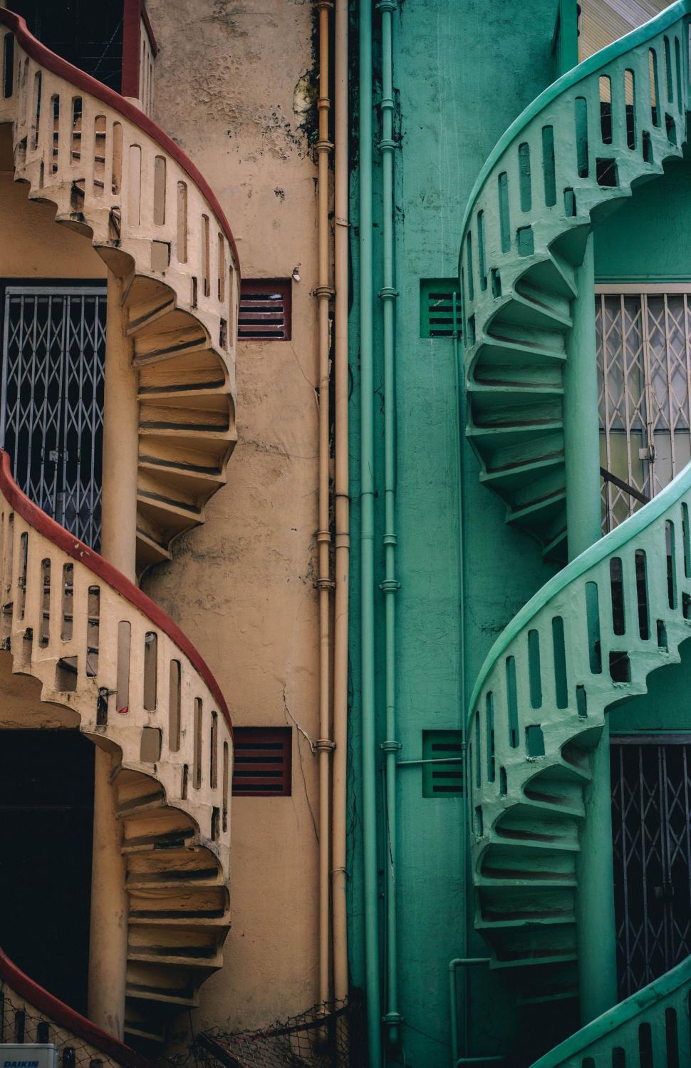 Free Image of Spiral Staircase Next to Old Building 