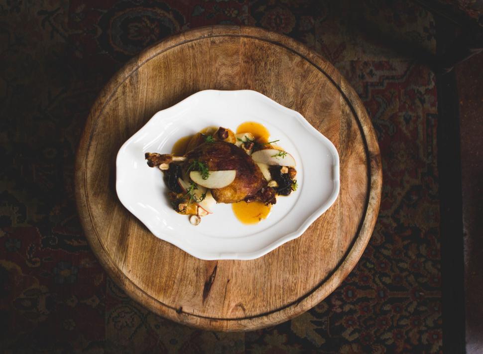 Free Image of Wooden Table Topped With Plate of Food 