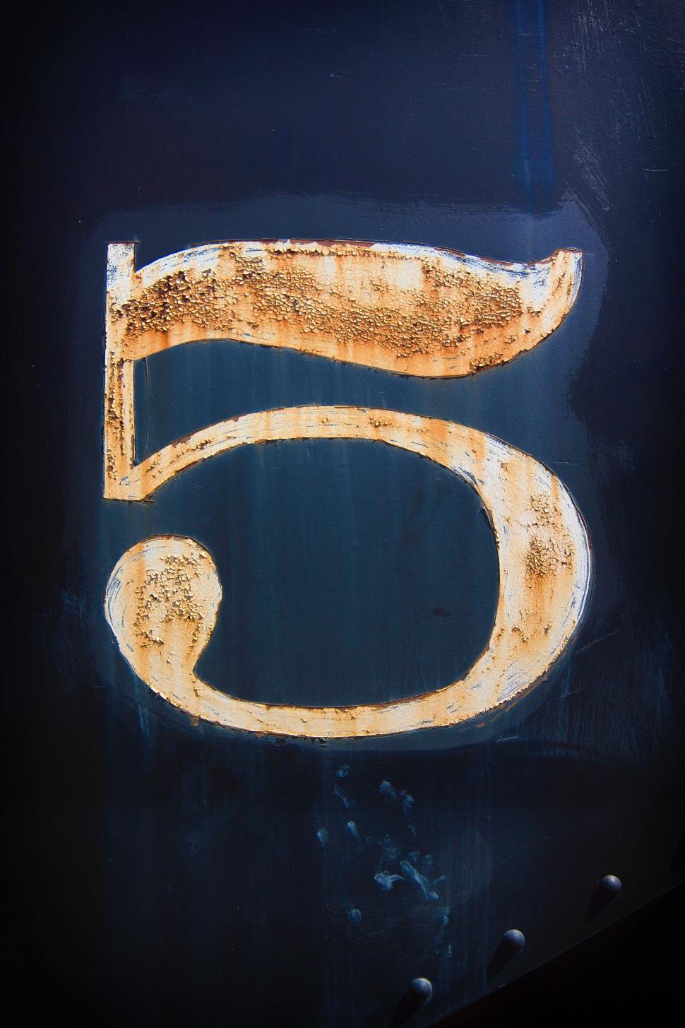 Free Image of Close Up of Number Five on Sign 