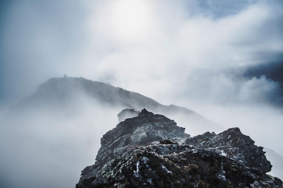 Free Image of Mountain Covered in Fog and Clouds on Cloudy Day 