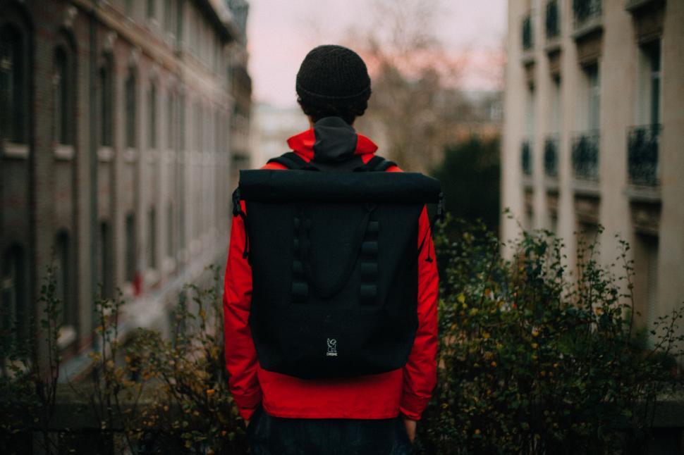 Free Image of Person Walking Down Street With Backpack 