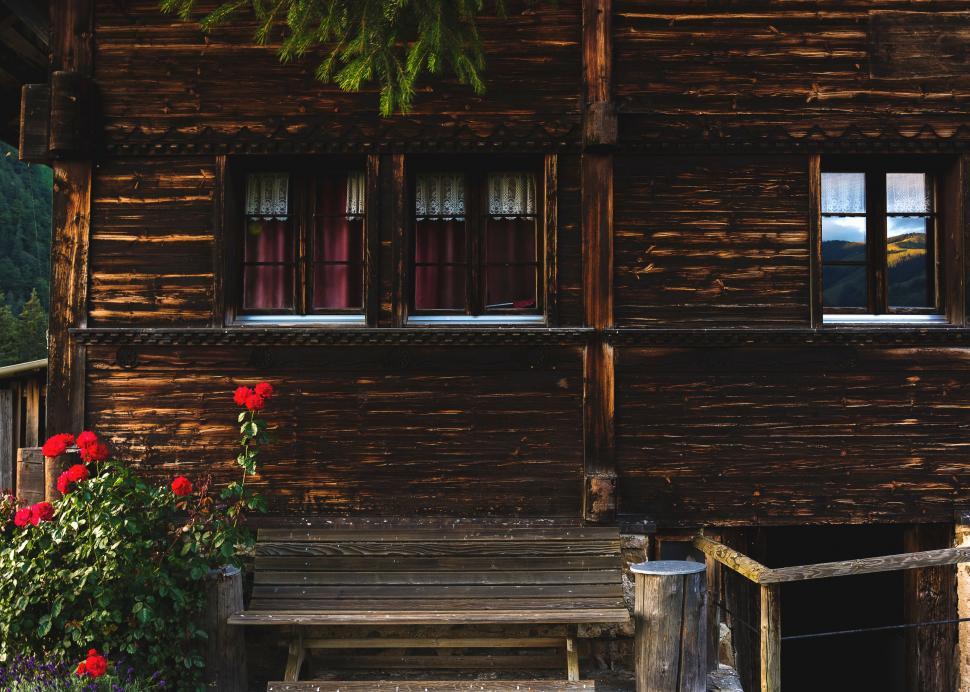 Free Image of Wooden House With Bench in Front 