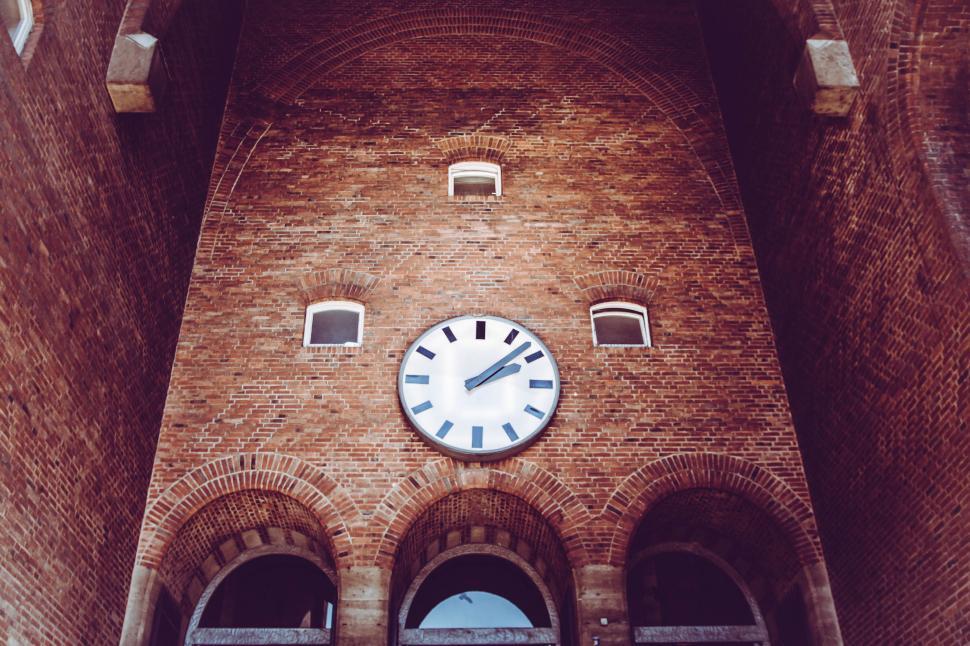 Free Image of Clock on the Side of a Brick Building 