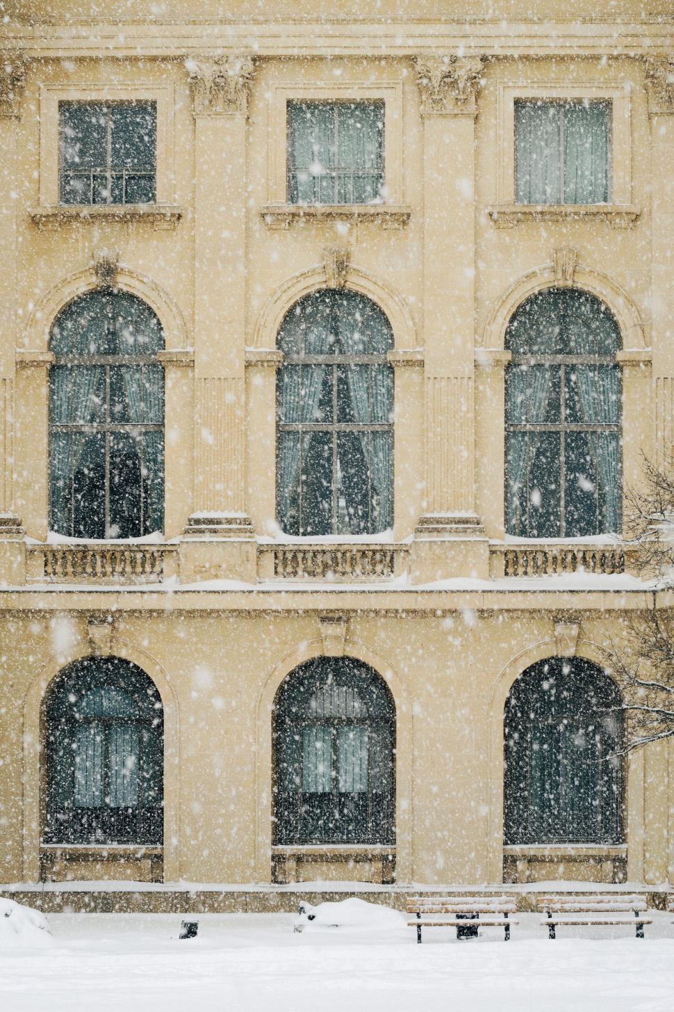 Free Image of Building With Snow-Covered Windows 