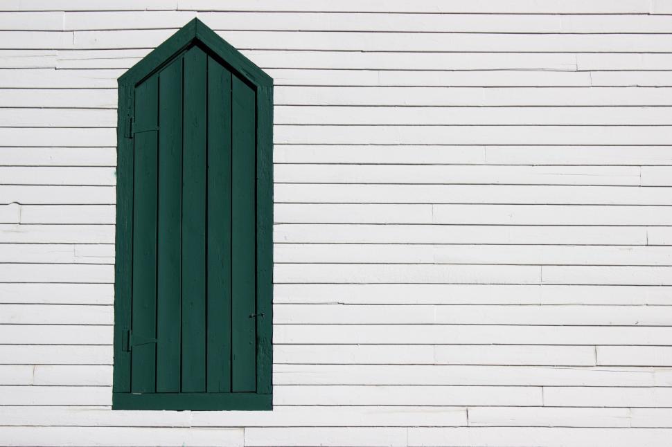 Free Image of A Green Window on a White Brick Wall 