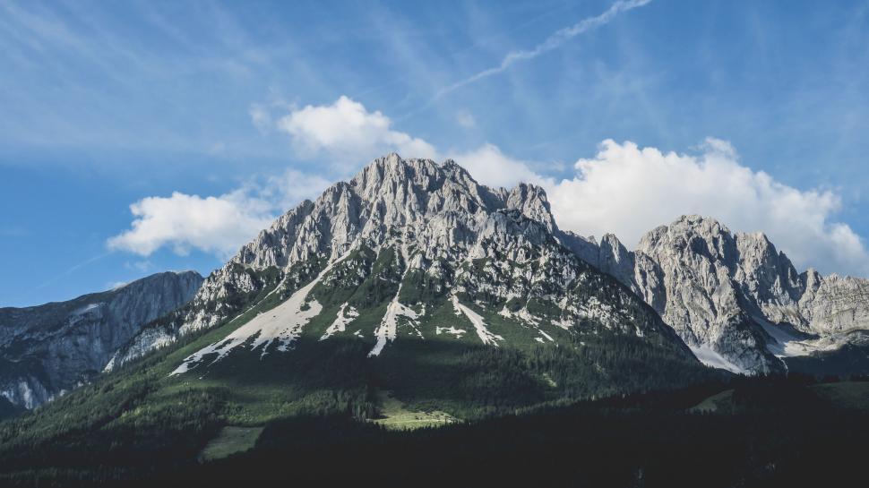 Free Image of Majestic Mountain Range With Clouds in Sky 