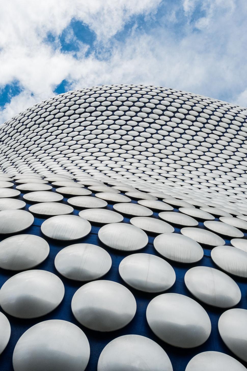 Free Image of Building Covered in White Circles 