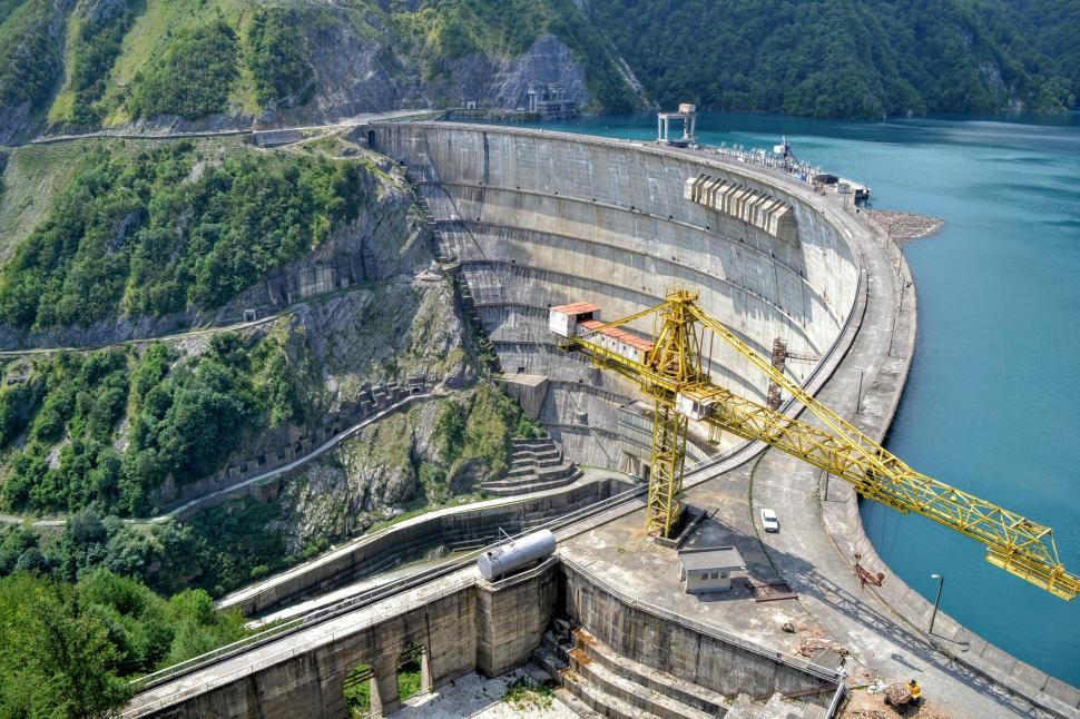 Free Image of Large Yellow Crane on Top of Dam 