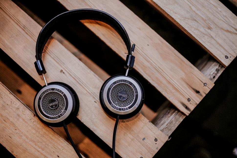 Free Image of Headphones Resting on Wooden Table 