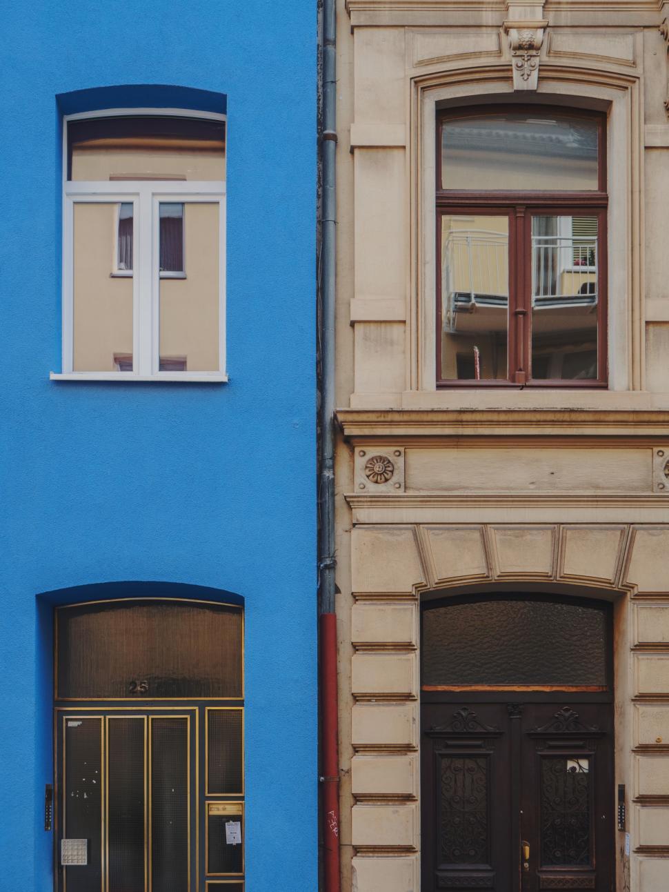 Free Image of Blue Building With Black Door and Windows 