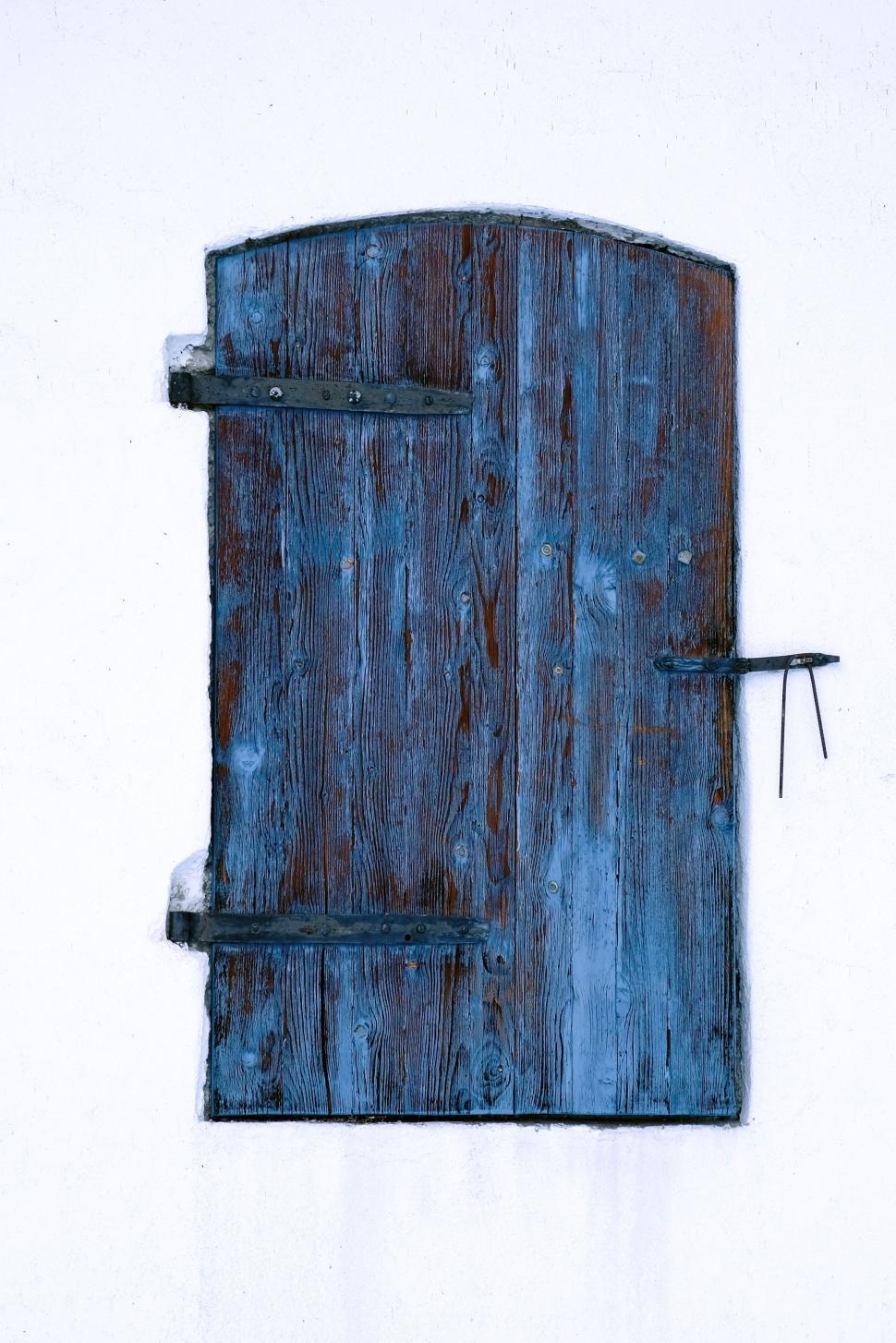 Free Image of A Blue Door With Small Window Painting 