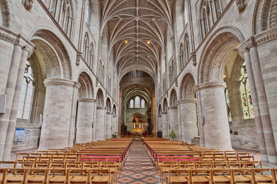Free Image of Grand Cathedral Filled With Wooden Chairs 