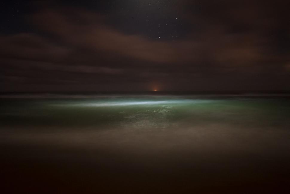 Free Image of Moonlit Ocean Waves at Night 