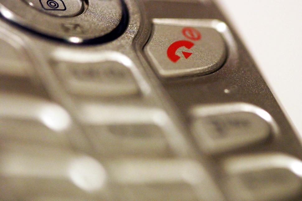 Free Image of Close Up of Cell Phone With Red Arrow 