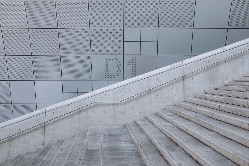 Free Image of Man Walking Down a Flight of Stairs 