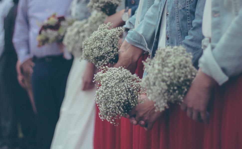Free Image of Group of People Holding Bouquets 