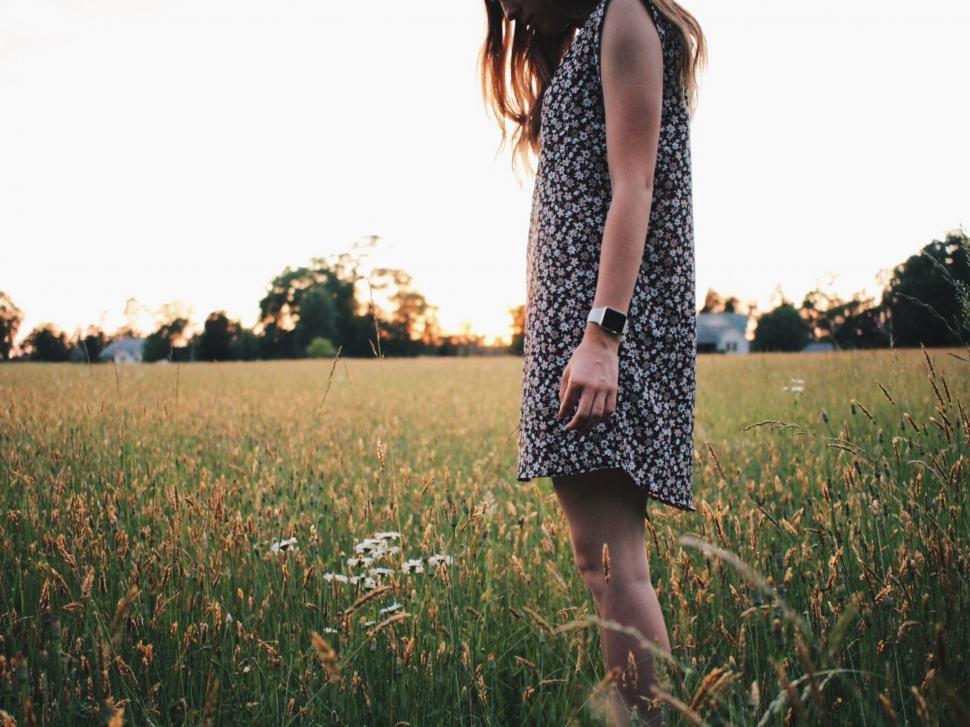 Free Image of Woman Standing in Field of Tall Grass 