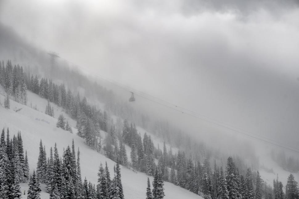 Free Image of Person Skiing Down Snow Covered Mountain 