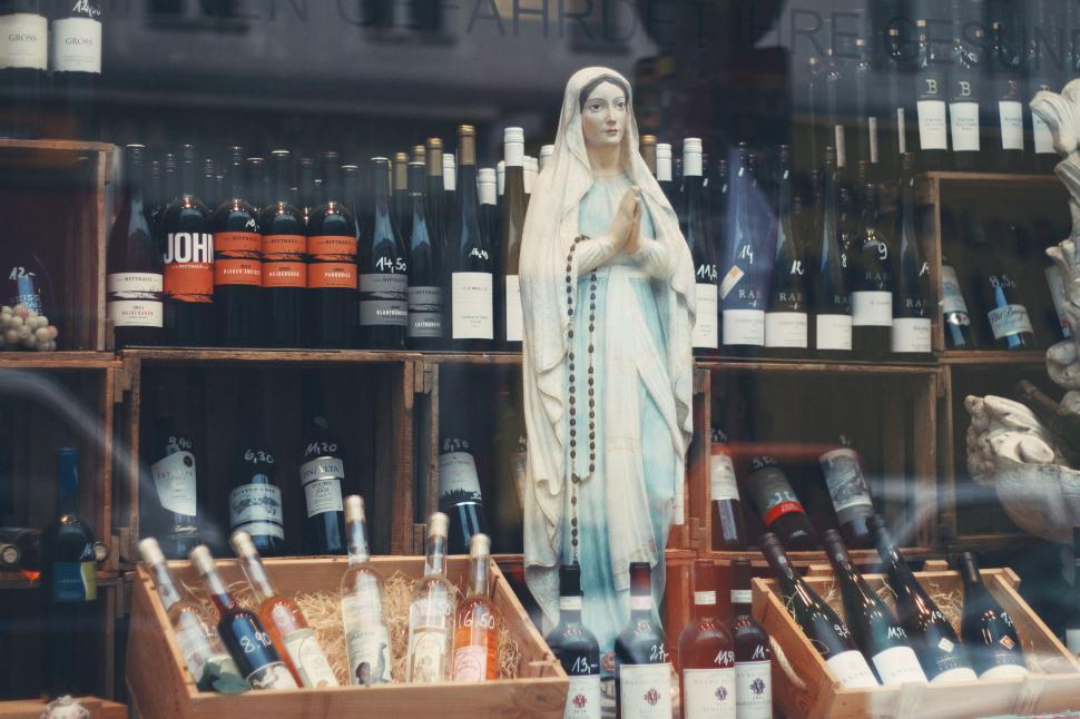 Free Image of Statue of the Virgin Mary in a Store Window 
