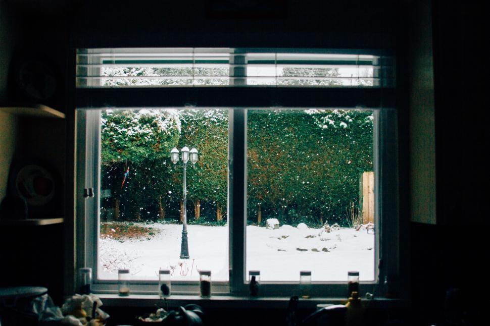 Free Image of Snowy Yard Seen Through Window 