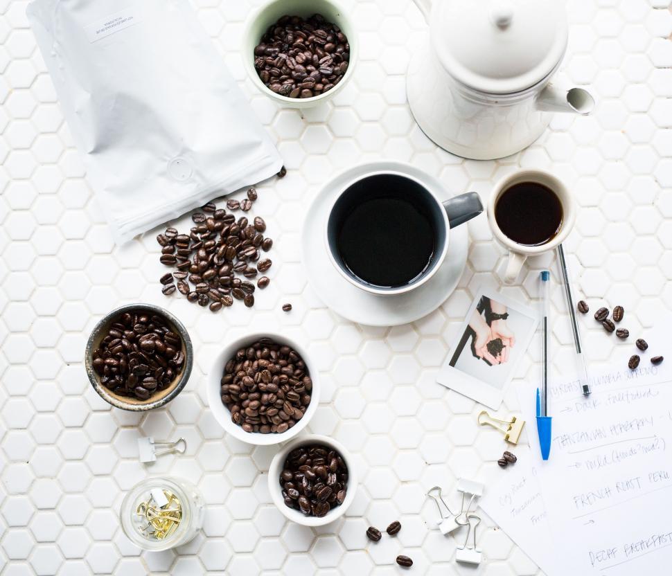 Free Image of Table With Cups of Coffee and Various Items 